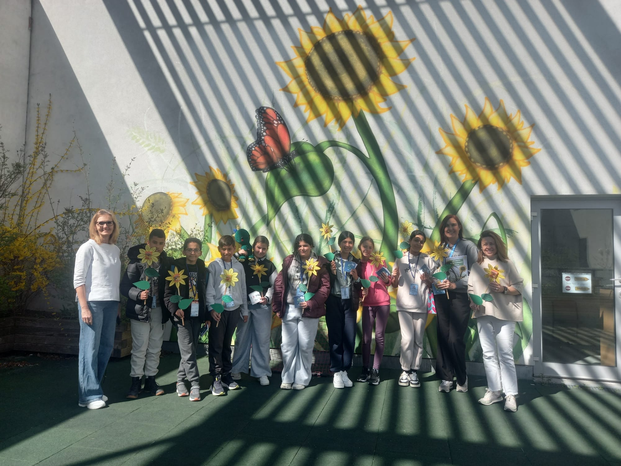 Students proudly displaying their certificates of completion